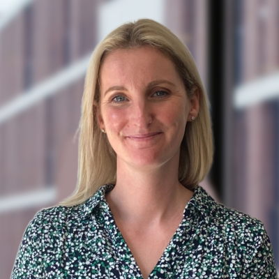 Image of lady with short blonde hair and green shirt